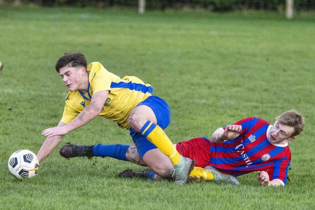 Whitchurch Herald: Action from Wem Town's defeat at Morda United. Picture by Andrew Donnison.